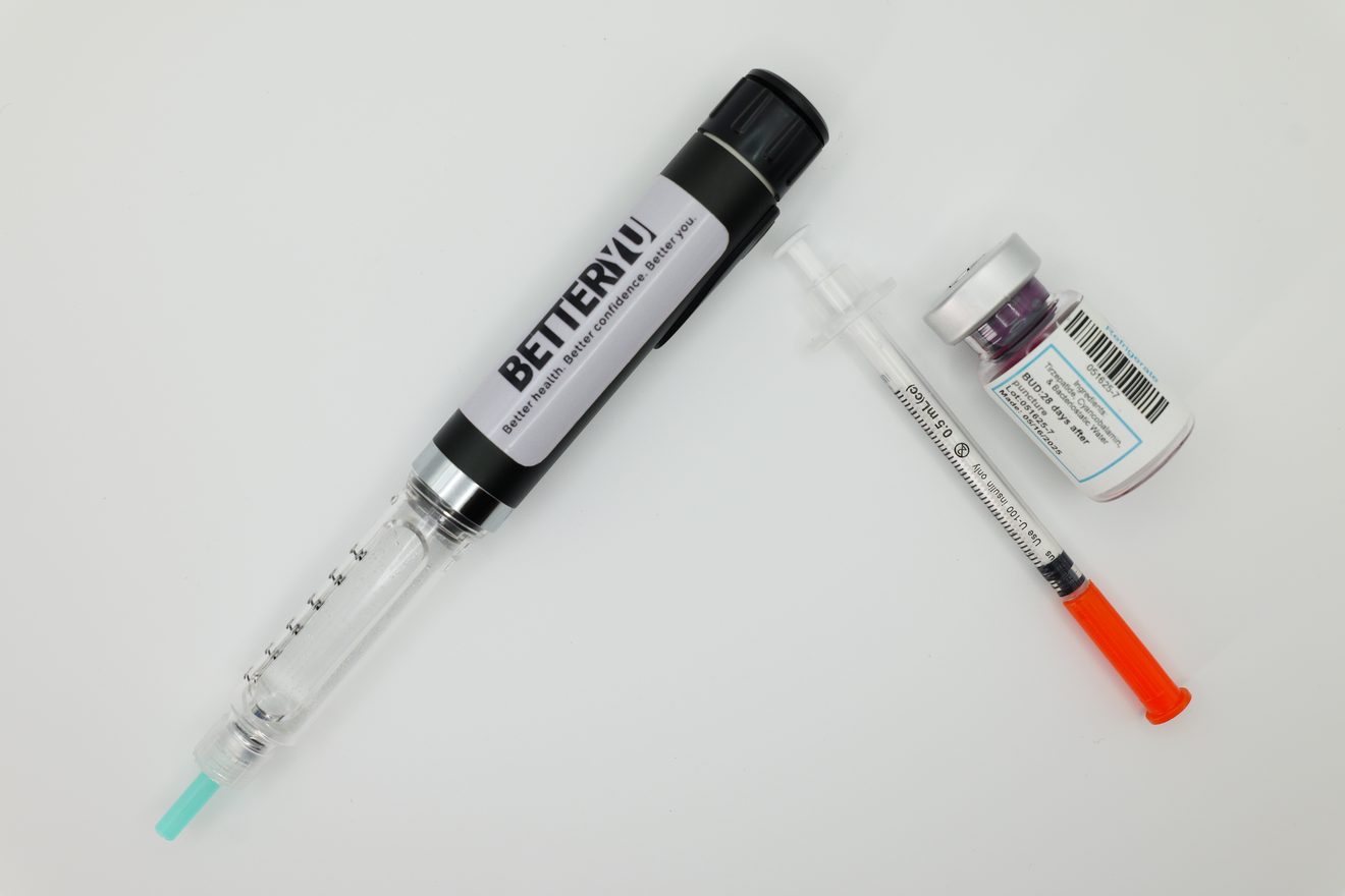 BetterYu pre-dosed pen beside a traditional vial and syringe